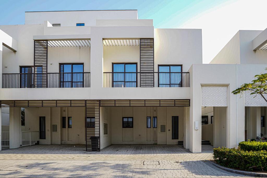 an exterior view of an apartment building with a courtyard at Luxury Villa by the sea in Fujairah
