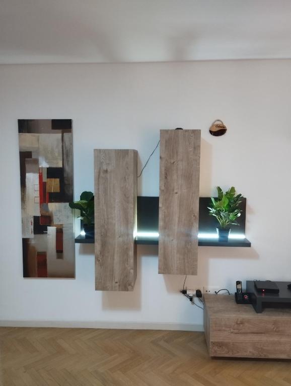 a room with three pieces of art on the wall at BEAU APPARTEMENT in Suresnes