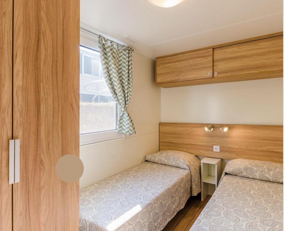 Postel nebo postele na pokoji v ubytování EUROCAMPINGPACENGO