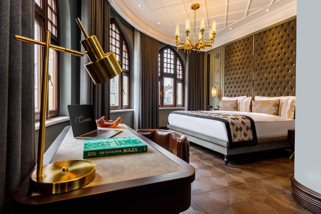 a hotel room with a king bed and a desk with a desk at Cronton Hotel Design in Istanbul