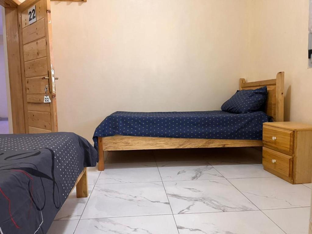 Llit o llits en una habitació de Chaaban Department