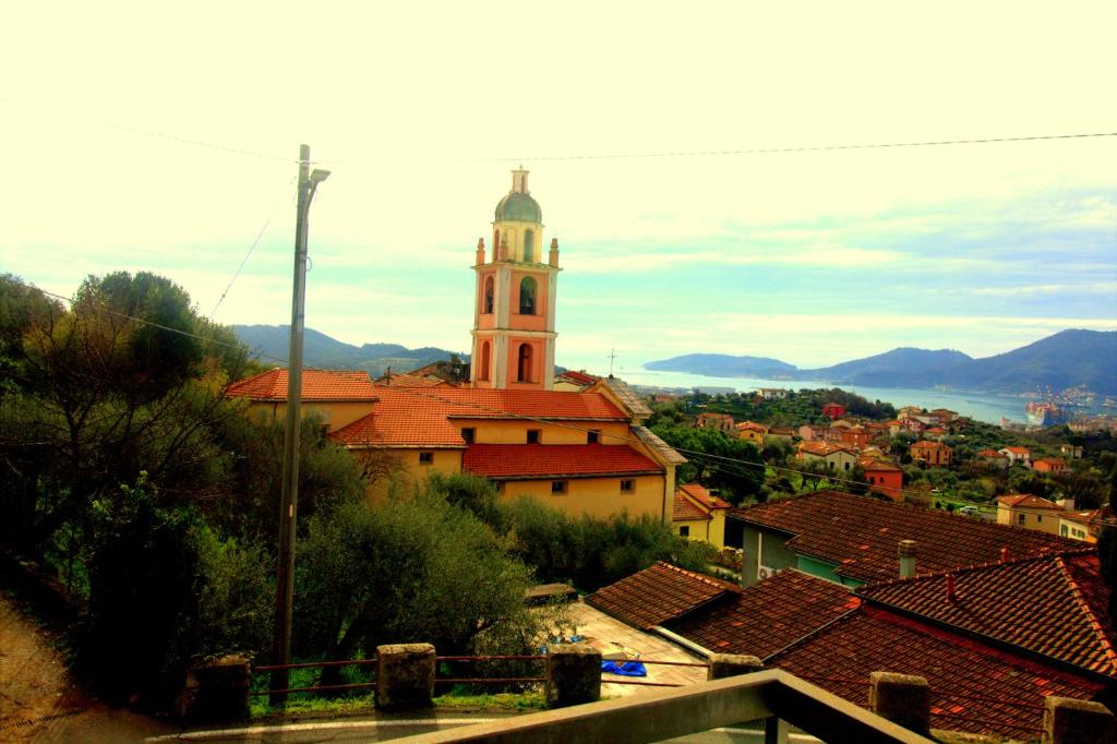 a view of a town with a church at I LIMONI in La Spezia