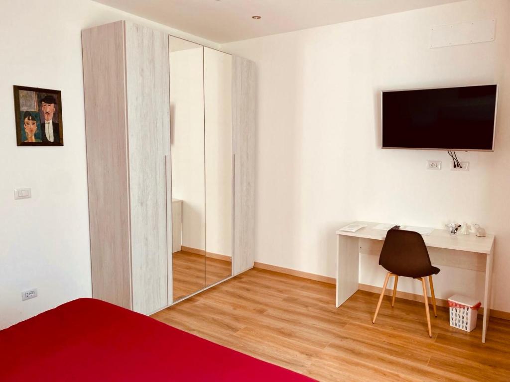 TV a/nebo společenská místnost v ubytování Aria di Casa Experience