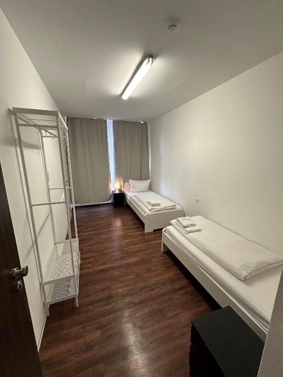 Postel nebo postele na pokoji v ubytování Potsdamer Inn