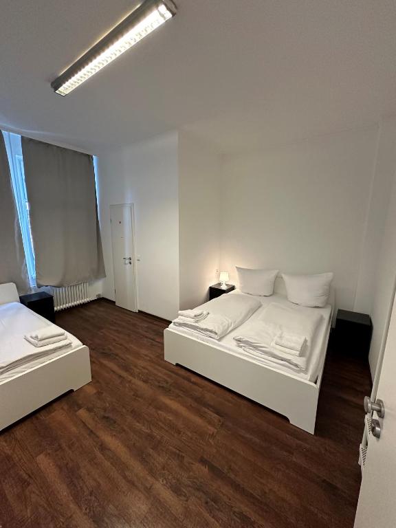 Postel nebo postele na pokoji v ubytování Potsdamer Inn