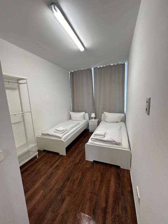 Postel nebo postele na pokoji v ubytování Potsdamer Inn