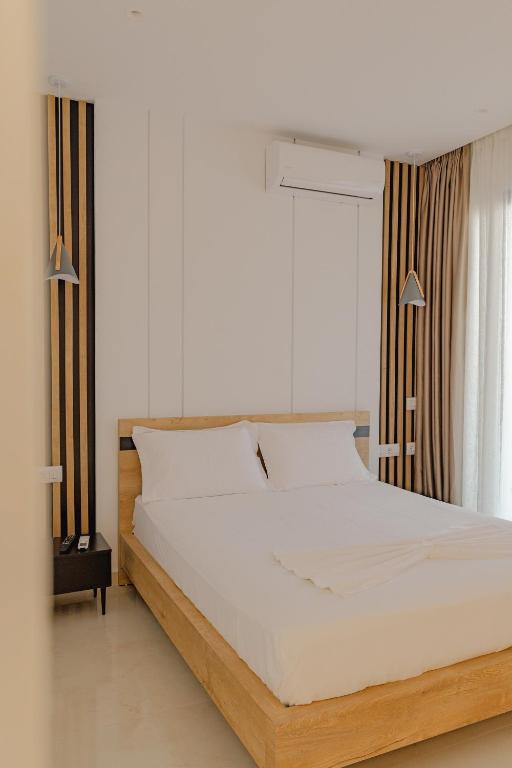 Postel nebo postele na pokoji v ubytování Villa Xhefri 2