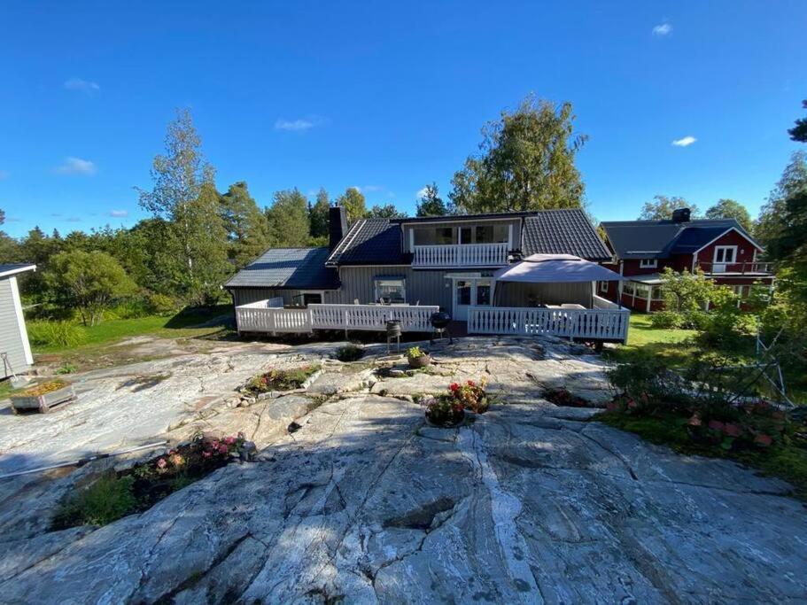 a house on top of a large rock at Nordic Villa in Husum