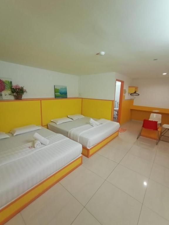Postel nebo postele na pokoji v ubytování Hotel Abby IGB Tasek
