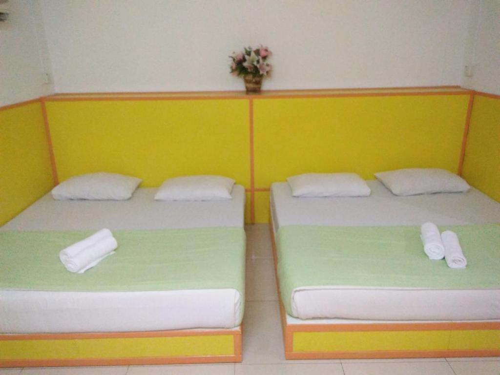 Postel nebo postele na pokoji v ubytování Hotel Abby IGB Tasek