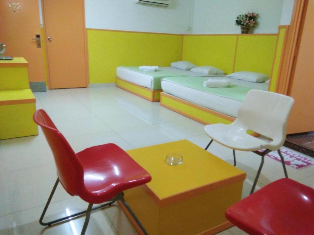 Postel nebo postele na pokoji v ubytování Hotel Abby IGB Tasek