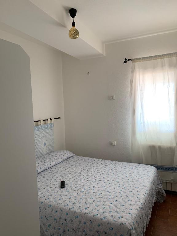 Łóżko lub łóżka w pokoju w obiekcie Perla marina House