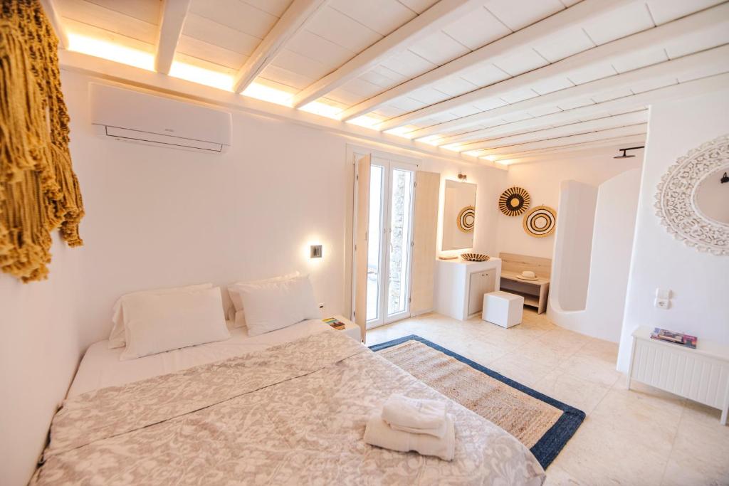 Posteľ alebo postele v izbe v ubytovaní Villa Poppy Mykonos