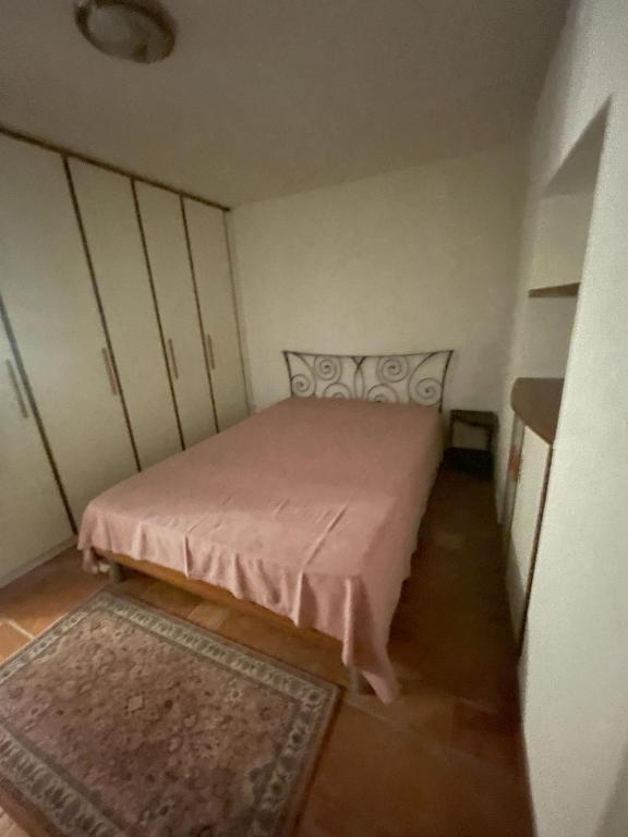 Postel nebo postele na pokoji v ubytování Panoramic Orselina