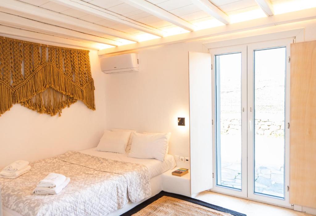Posteľ alebo postele v izbe v ubytovaní Villa Poppy Mykonos