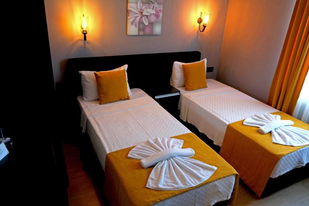 Postel nebo postele na pokoji v ubytování Yasemin Hotel