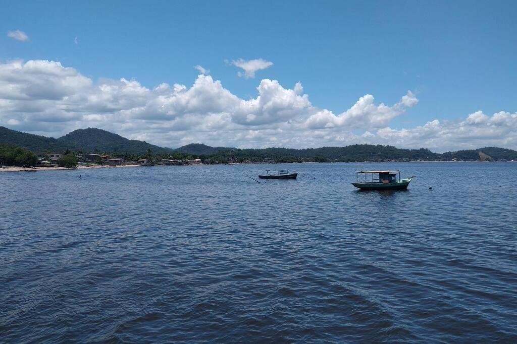 two boats on a large body of water at Casa da Alvenaria- Praia de Mauá in Rio de Janeiro