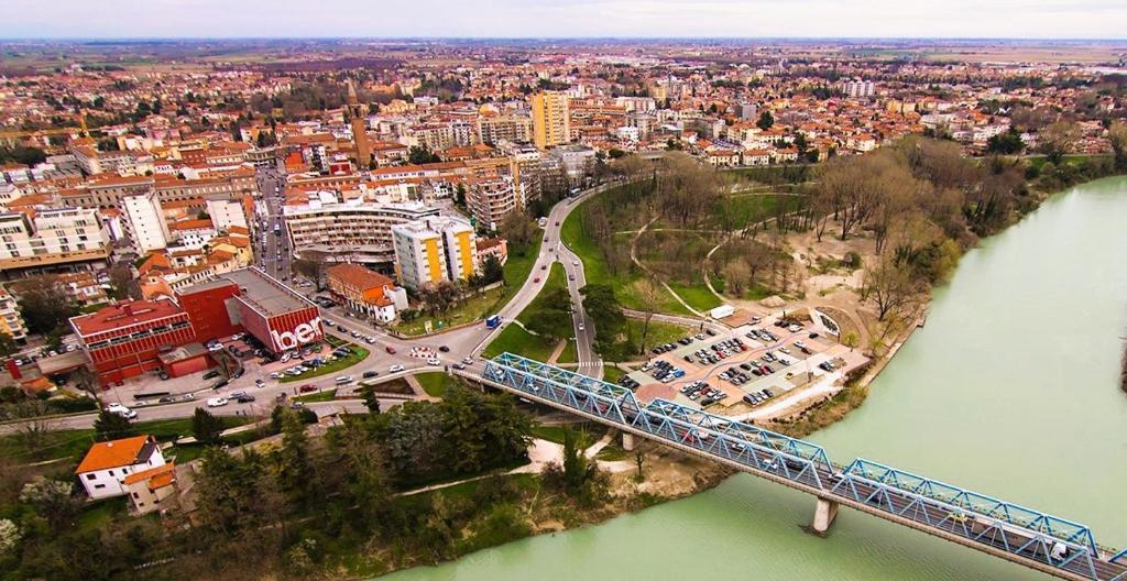 a bridge over a river with a train on it at Hotel Kristall in San Donà di Piave
