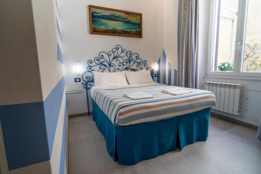 Postel nebo postele na pokoji v ubytování Teresa Rooms & Suites