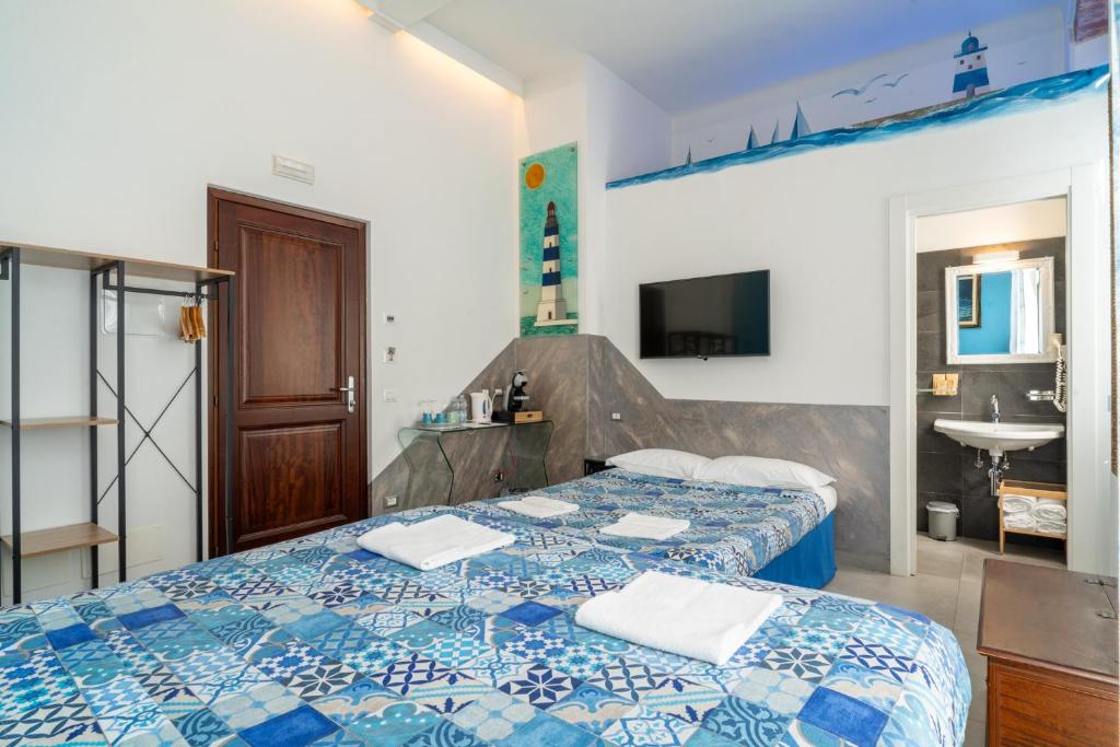 Postel nebo postele na pokoji v ubytování Teresa Rooms & Suites