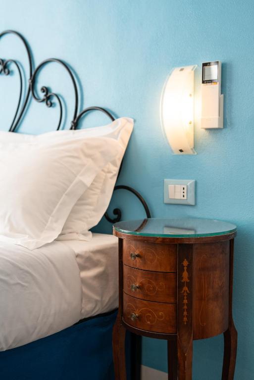 Postel nebo postele na pokoji v ubytování Teresa Rooms & Suites