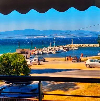 a view of a marina with cars parked in a parking lot at Villa Mare Lux in Nea Fokea
