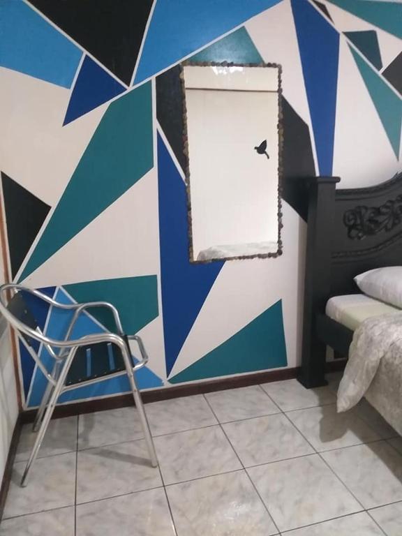 Postel nebo postele na pokoji v ubytování Downtown Montezuma Hostel