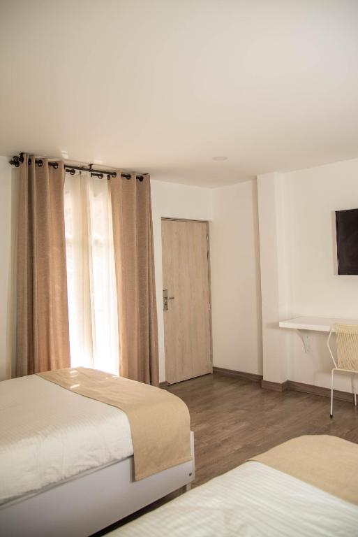 Postel nebo postele na pokoji v ubytování Medellín Vibes Hostel