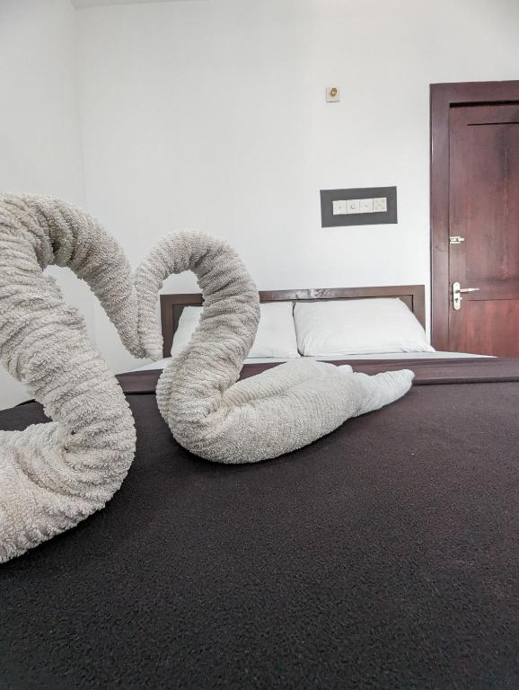 Postel nebo postele na pokoji v ubytování Big John Hotel