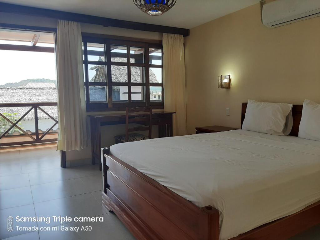 Postel nebo postele na pokoji v ubytování Hotel La Vista