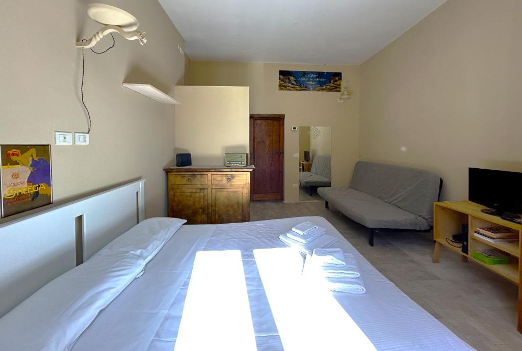 Łóżko lub łóżka w pokoju w obiekcie Appartamento Firenze Mayer