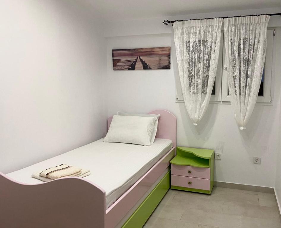 Postel nebo postele na pokoji v ubytování Ionion Seaside Home