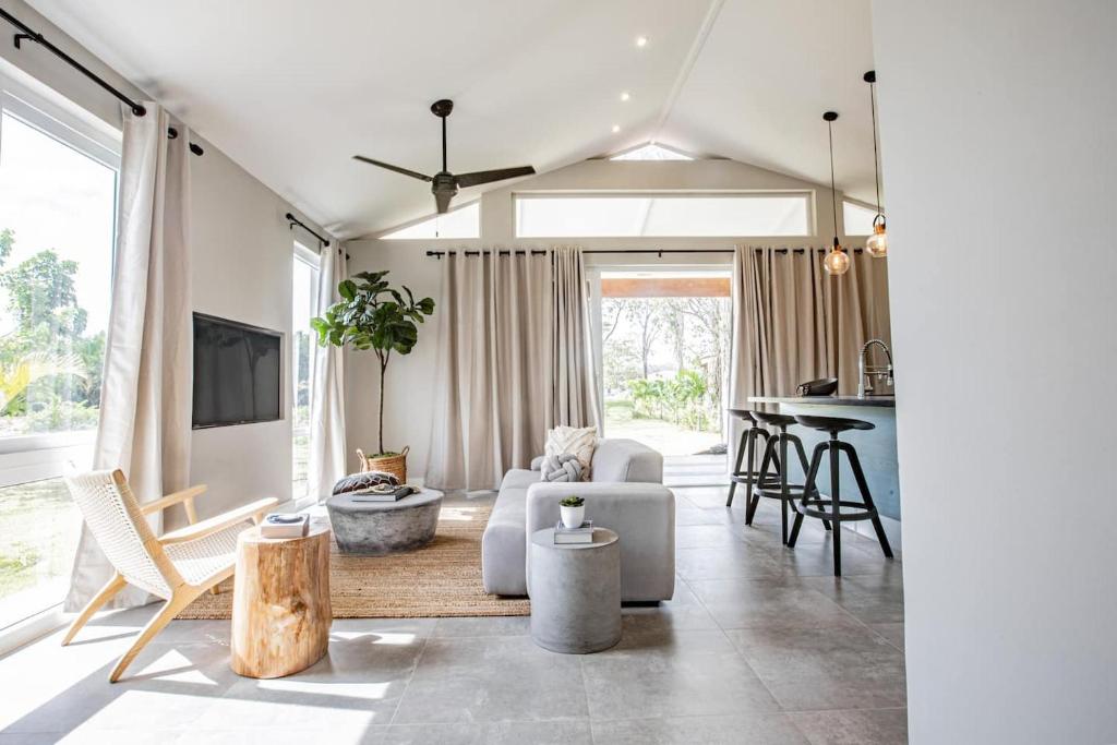 a living room with a couch and a table at Nearly Oceanfront Blue 3 Bedroom Spacious Villa in Playa Venao