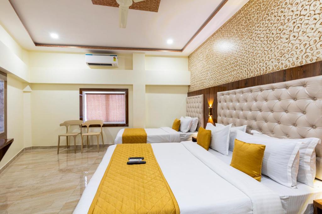 Postel nebo postele na pokoji v ubytování Hotel New Imperial