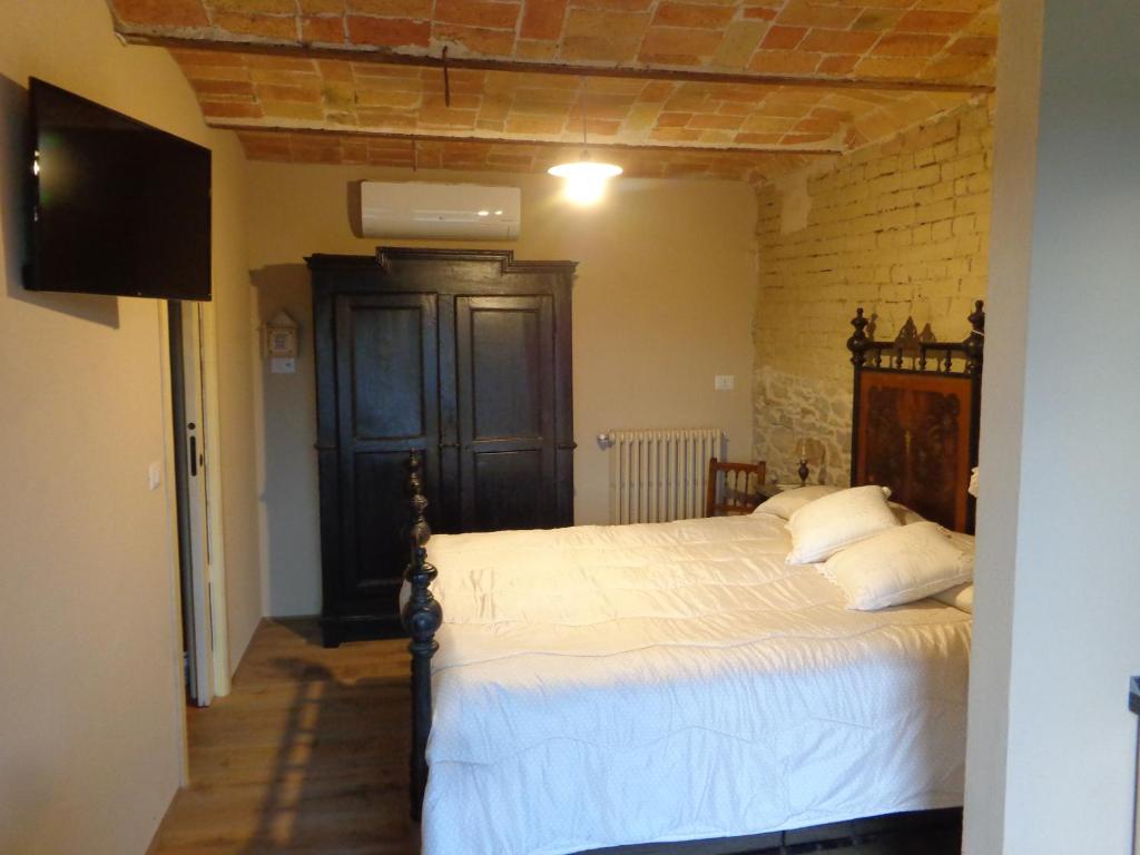 Postel nebo postele na pokoji v ubytování Cascina Romanino