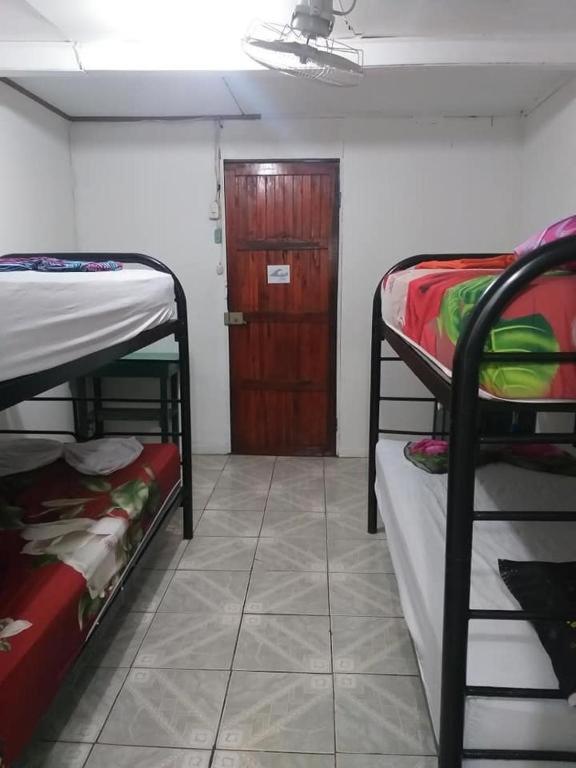 Postel nebo postele na pokoji v ubytování Downtown Montezuma Hostel