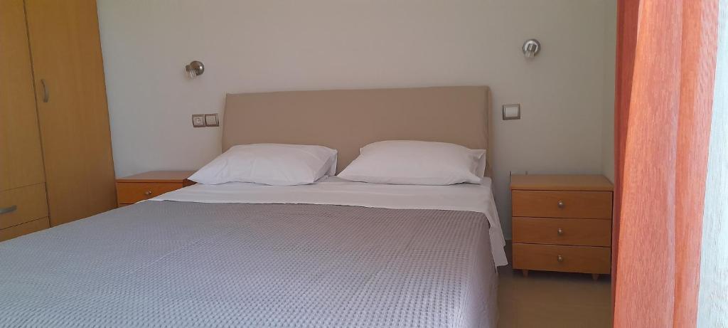 Postel nebo postele na pokoji v ubytování ioli