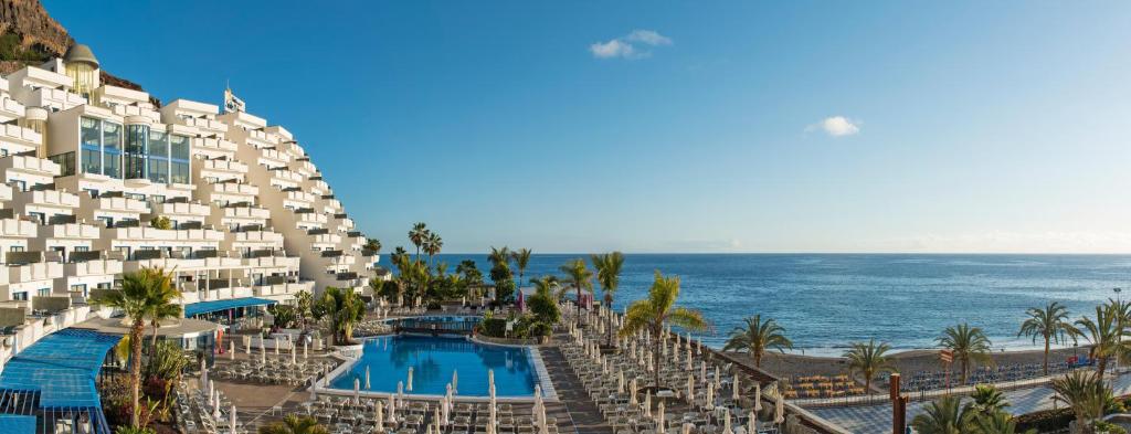 an aerial view of the hotel and the ocean at TUI BLUE Suite Princess - Adults Only in Taurito