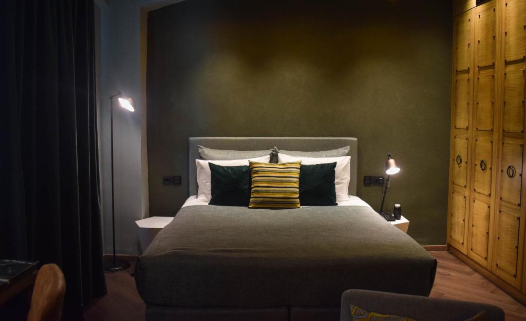 Łóżko lub łóżka w pokoju w obiekcie Pagopoieion - Adults Only Suites