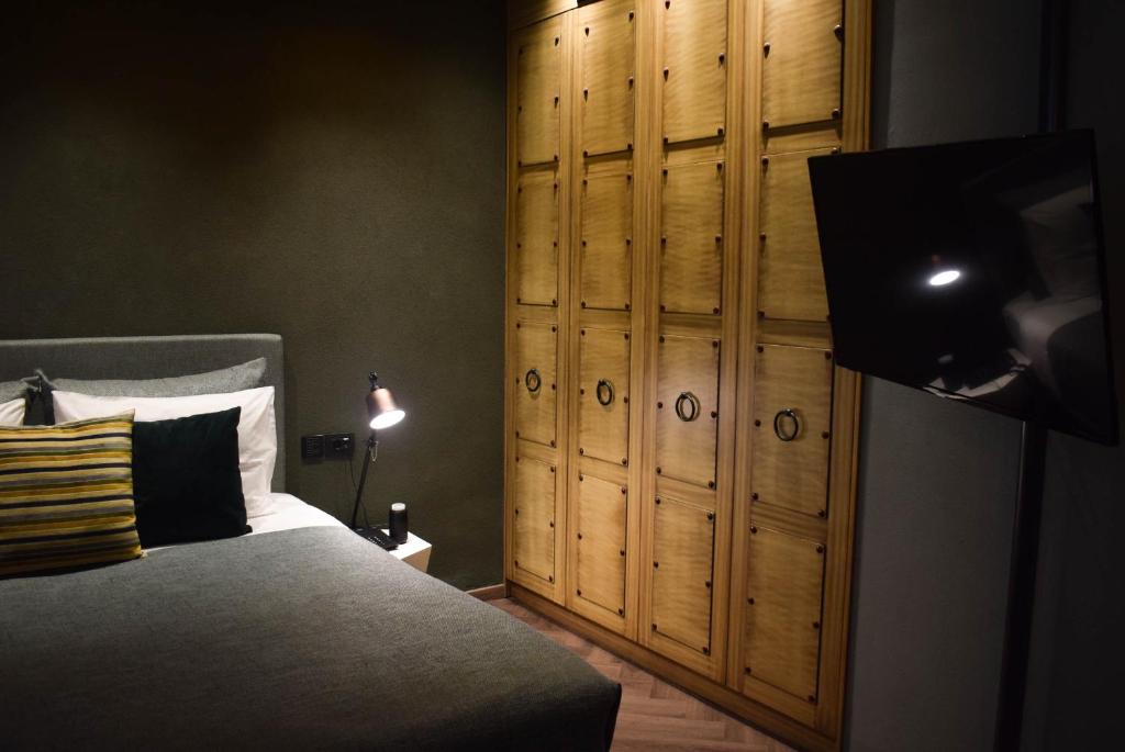 Łóżko lub łóżka w pokoju w obiekcie Pagopoieion - Adults Only Suites