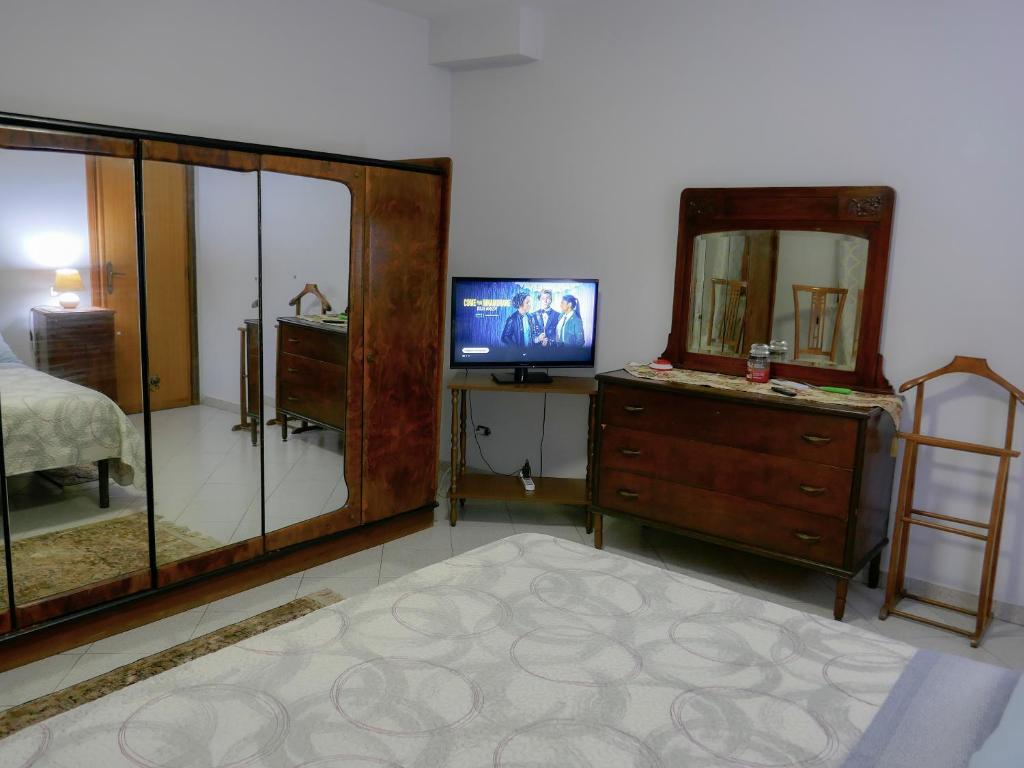 TV a/nebo společenská místnost v ubytování Le Magnolie house and Jubilee