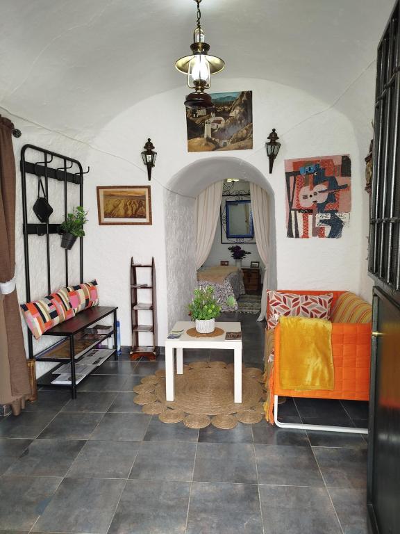 Postel nebo postele na pokoji v ubytování Cueva La Loli