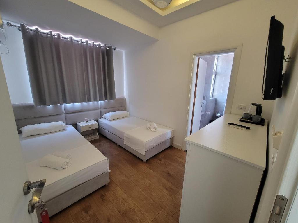 Postel nebo postele na pokoji v ubytování Hotel Myrtai - City Center