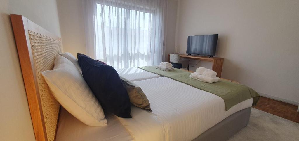 Postel nebo postele na pokoji v ubytování Azurara Guesthouse