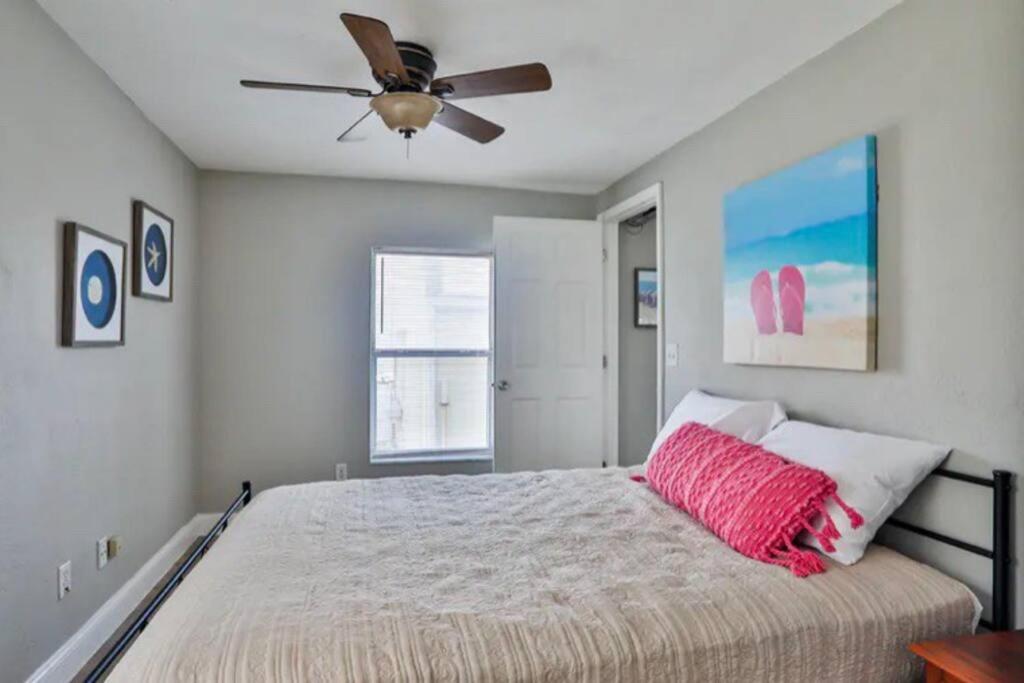 a bedroom with a bed and a ceiling fan at Summer Sands Lodge Unit 2 in Flagler Beach