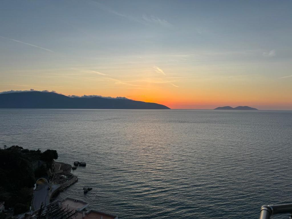 a sunset over a large body of water at Sea Scape Apartment 3 in Vlorë