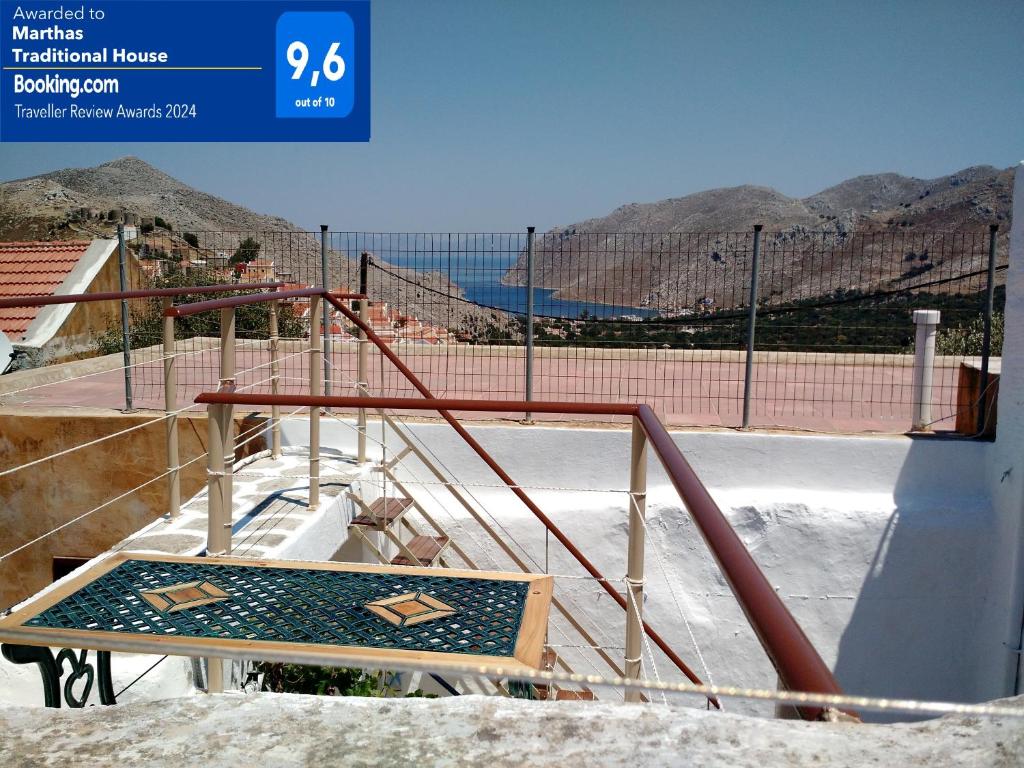 a ramp with a sign in front of a tennis court at Marthas Traditional House in Symi
