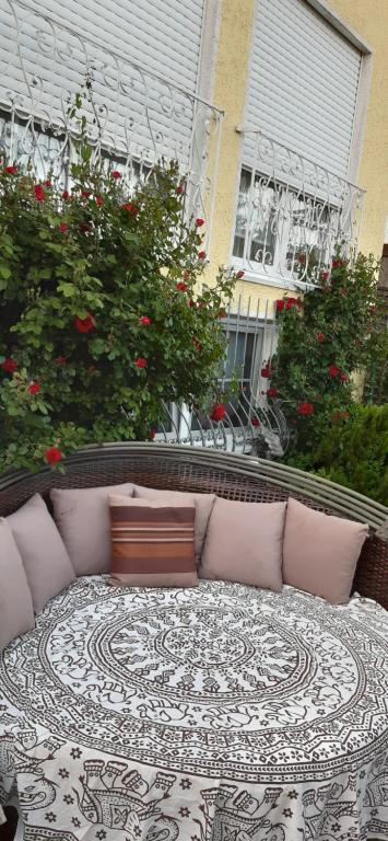 a couch sitting on top of a rug on a patio at Nensi in Ehekirchen