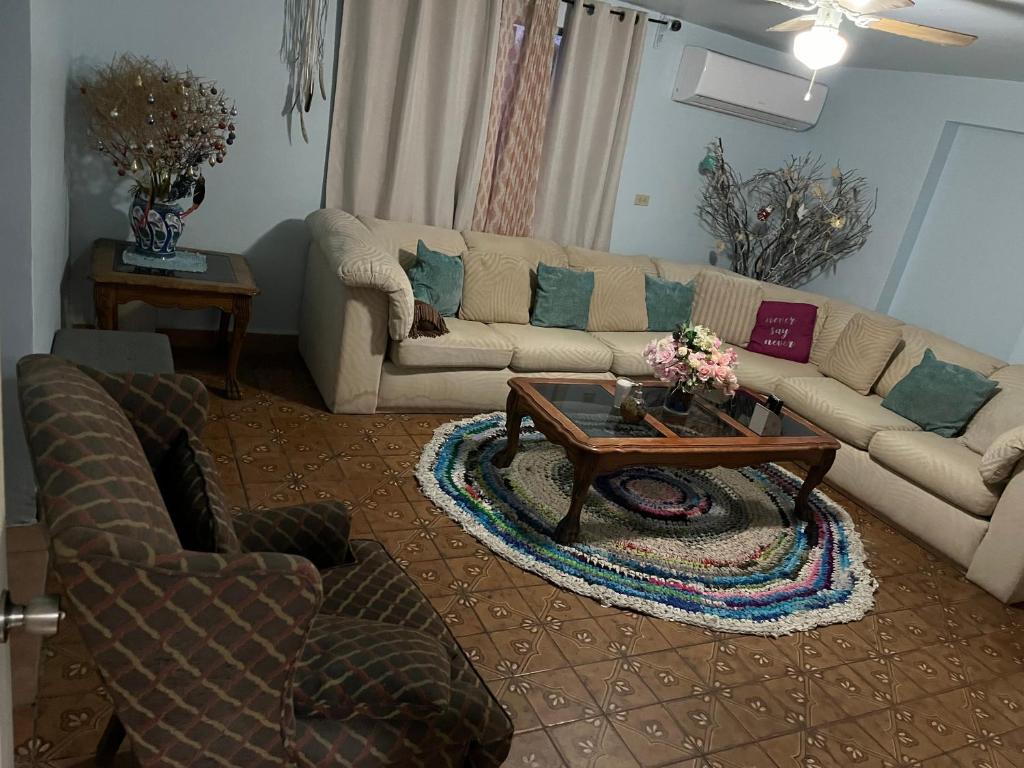 a living room with two couches and a coffee table at Casa Caribe in San Felipe