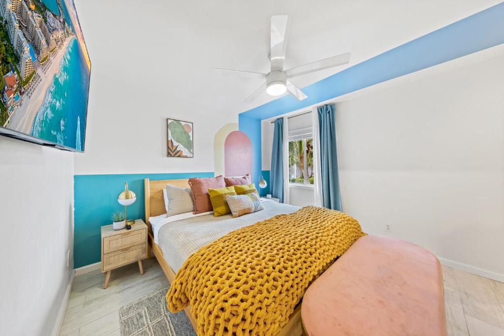 a bedroom with a bed and a ceiling fan at New Luxury Listing! Walking distance to shops, lake & beach in Destin